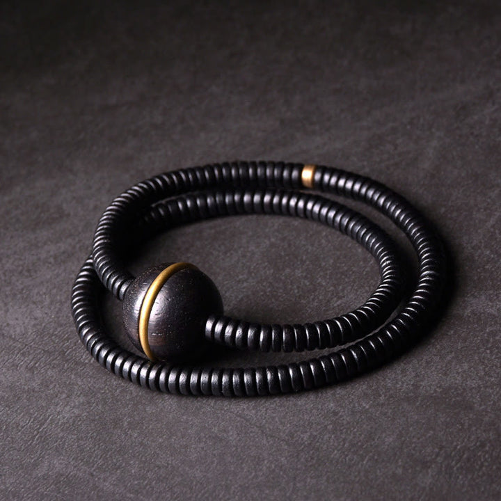 Bracelet et collier à double tour en forme de cuboïde avec boule d'équilibre en bois d'ébène et cuivre et Buddha Stones