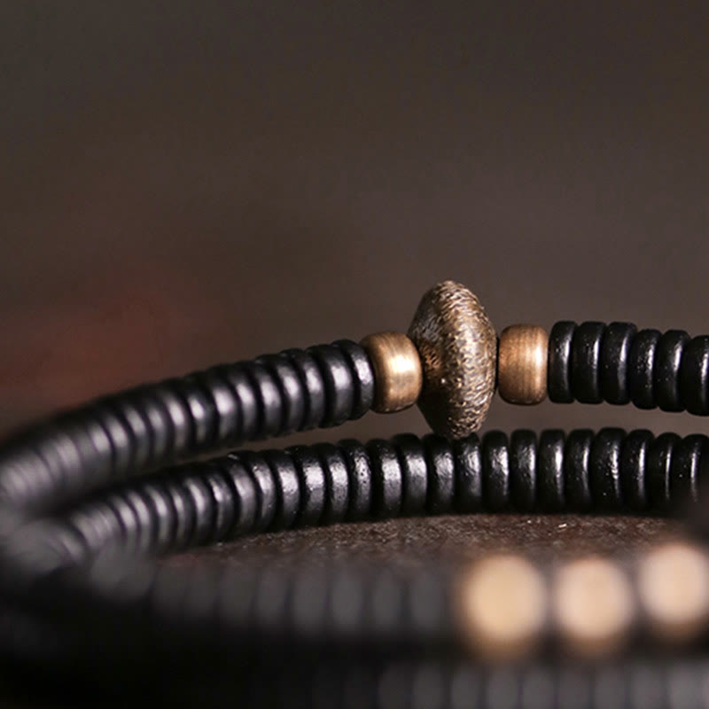 Bracelet double tour en bois d'ébène et cuivre avec Buddha Stones