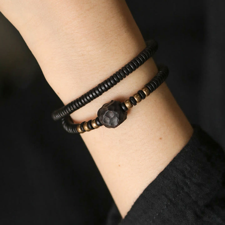 Bracelet double tour en bois d'ébène et cuivre avec Buddha Stones