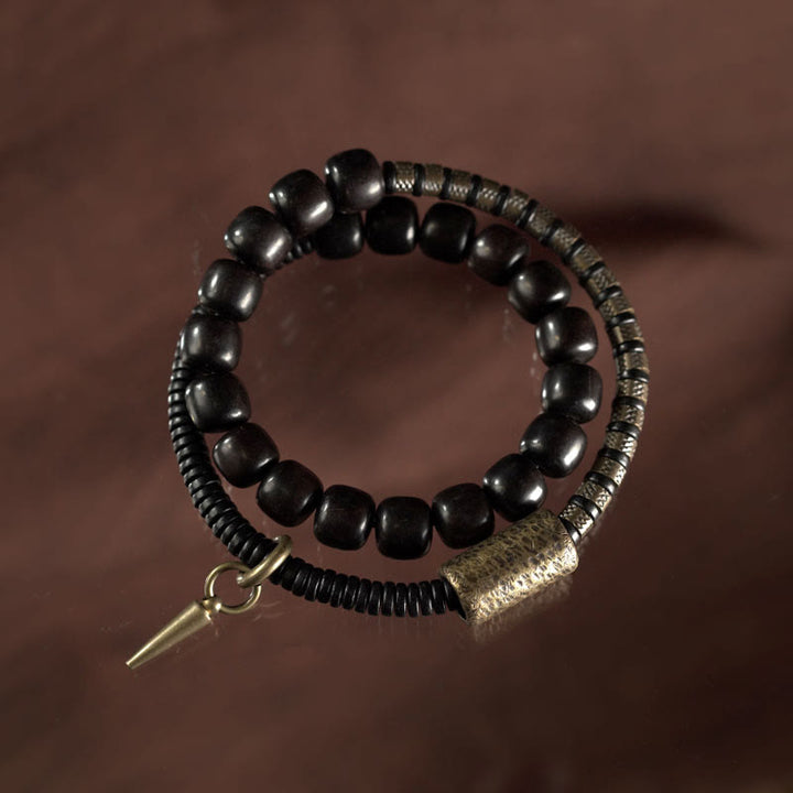 Bracelet d'équilibre à double tour en forme de cône avec perles vintage en bois d'ébène et cuivre et Buddha Stones