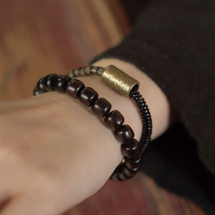 Bracelet d'équilibre à double tour en forme de cône avec perles vintage en bois d'ébène et cuivre et Buddha Stones