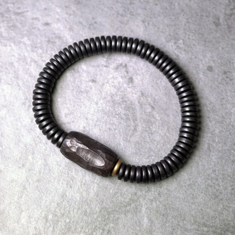 Bracelet d'équilibre troué en bois d'ébène et cuivre et laiton avec Buddha Stones