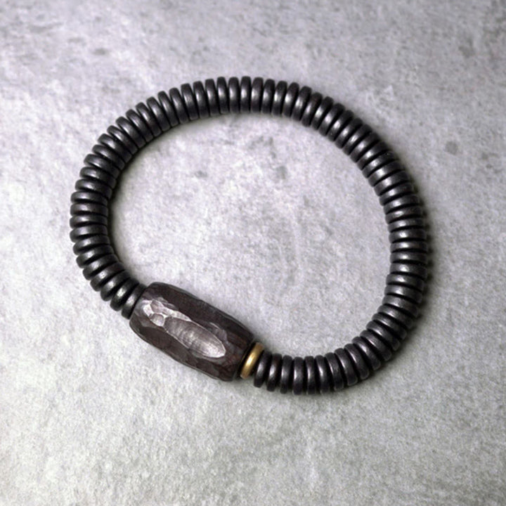 Bracelet d'équilibre troué en bois d'ébène et cuivre et laiton avec Buddha Stones