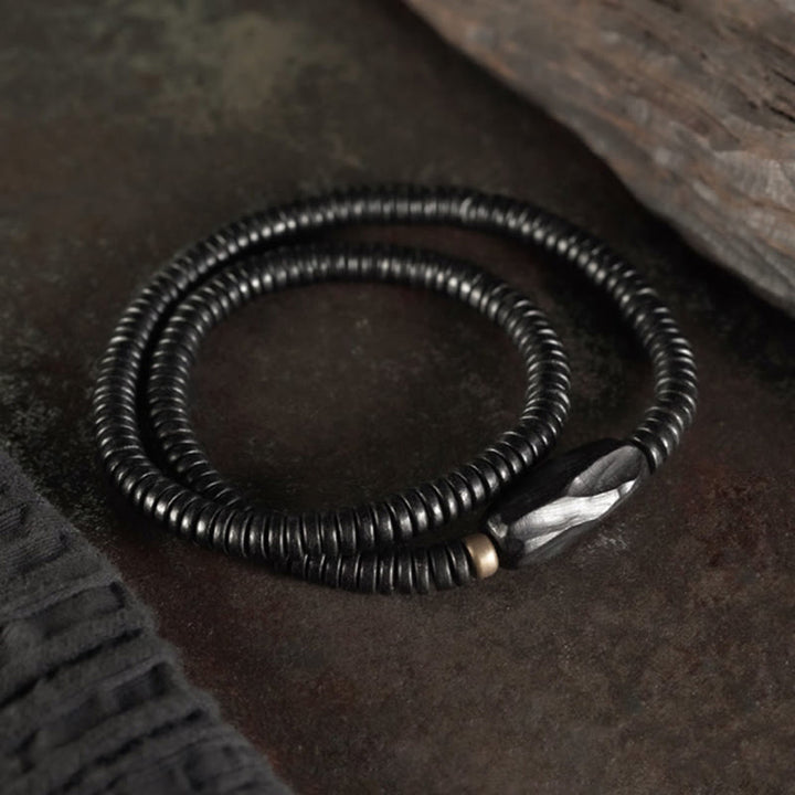 Bracelet triple tour en bois d'ébène, cuivre et laiton avec Buddha Stones