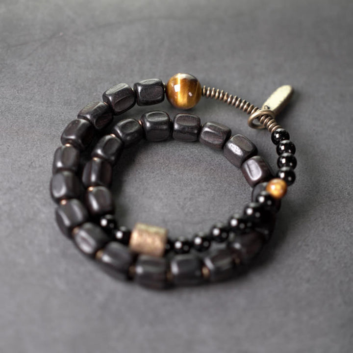 Bracelet double tour en Buddha Stones, bois d'ébène, cuivre, laiton, œil de tigre, paix