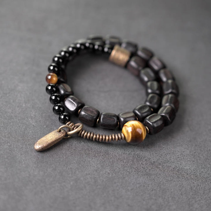 Bracelet double tour en Buddha Stones, bois d'ébène, cuivre, laiton, œil de tigre, paix
