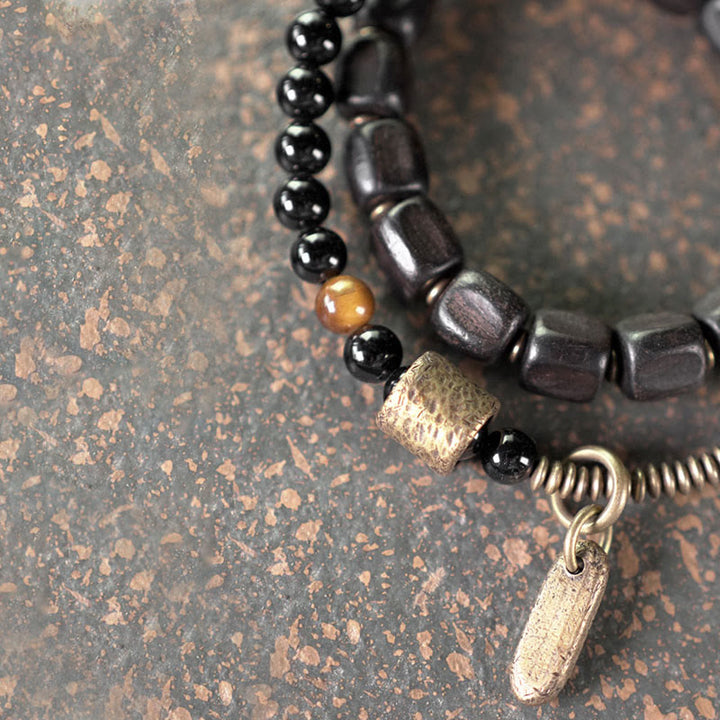 Bracelet double tour en Buddha Stones, bois d'ébène, cuivre, laiton, œil de tigre, paix