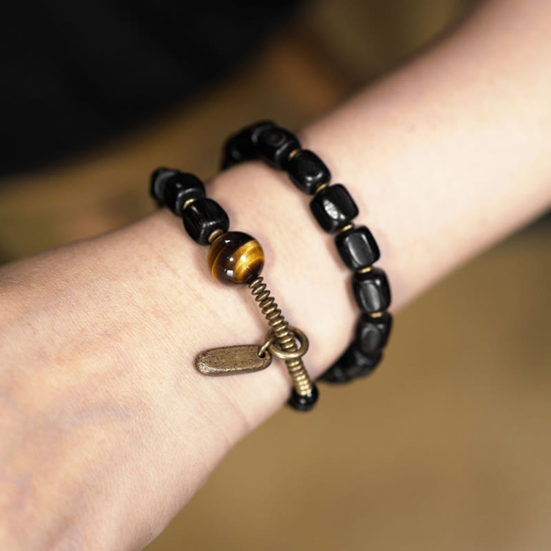 Bracelet double tour en Buddha Stones, bois d'ébène, cuivre, laiton, œil de tigre, paix