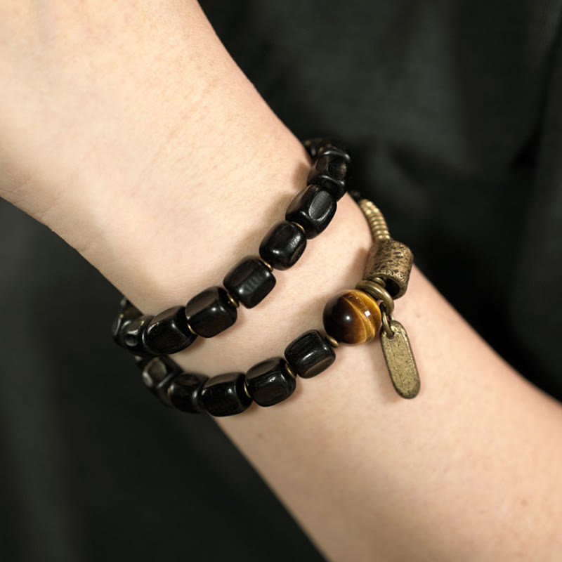 Bracelet double tour en Buddha Stones, bois d'ébène, cuivre, laiton, œil de tigre, paix
