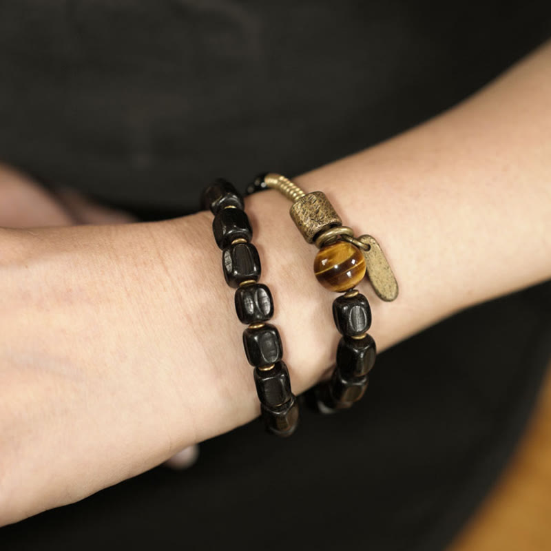 Bracelet double tour en Buddha Stones, bois d'ébène, cuivre, laiton, œil de tigre, paix