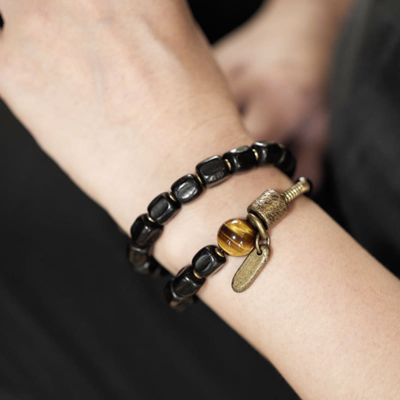 Bracelet double tour en Buddha Stones, bois d'ébène, cuivre, laiton, œil de tigre, paix