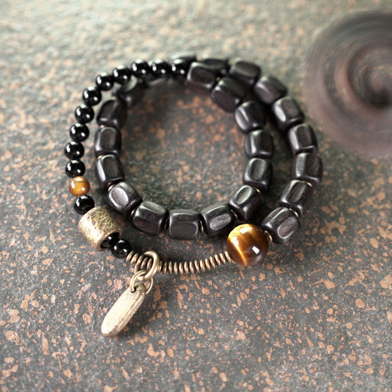 Bracelet double tour en Buddha Stones, bois d'ébène, cuivre, laiton, œil de tigre, paix