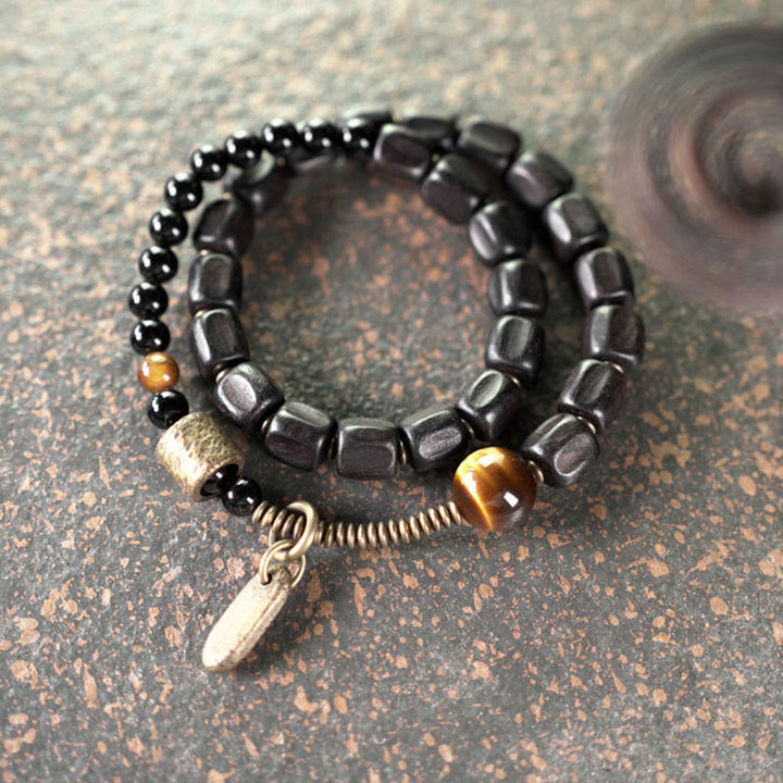 Bracelet double tour en Buddha Stones, bois d'ébène, cuivre, laiton, œil de tigre, paix