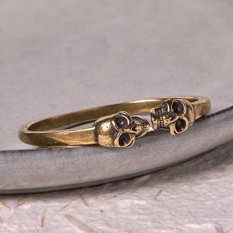 Bracelet manchette en cuivre et laiton avec double tête de mort et Buddha Stones Le Seigneur de la forêt des cadavres