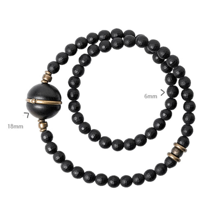 Bracelet de protection à double tour en perles d'ébène et d'onyx noir avec surface coupée givrée et Buddha Stones