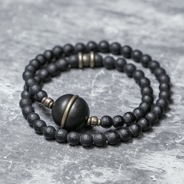 Bracelet de protection à double tour en perles d'ébène et d'onyx noir avec surface coupée givrée et Buddha Stones