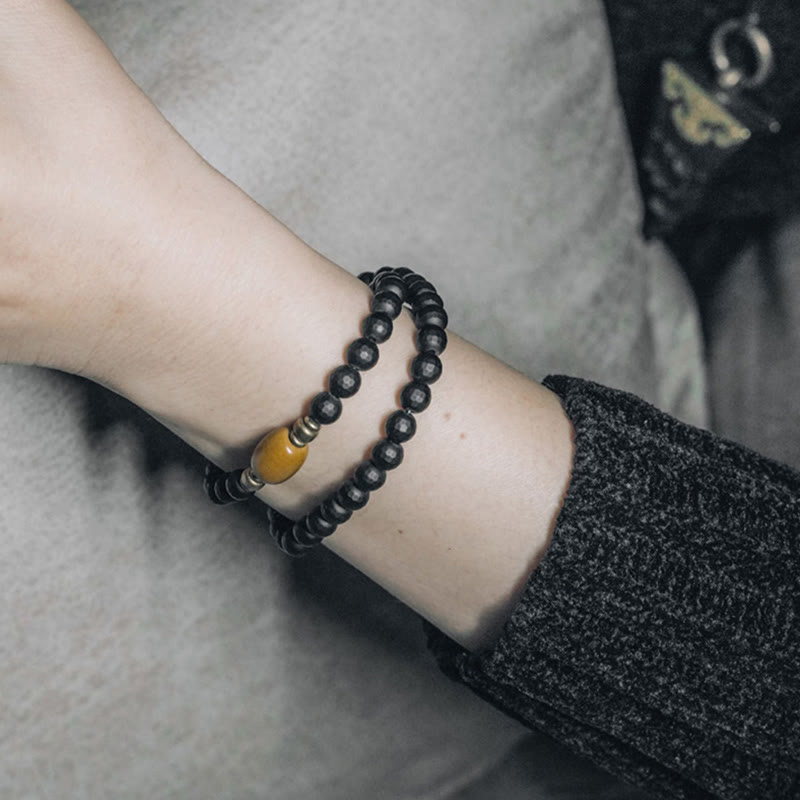 Bracelet de protection à double tour en perles d'onyx noir et de topaze à surface coupée givrée avec Buddha Stones