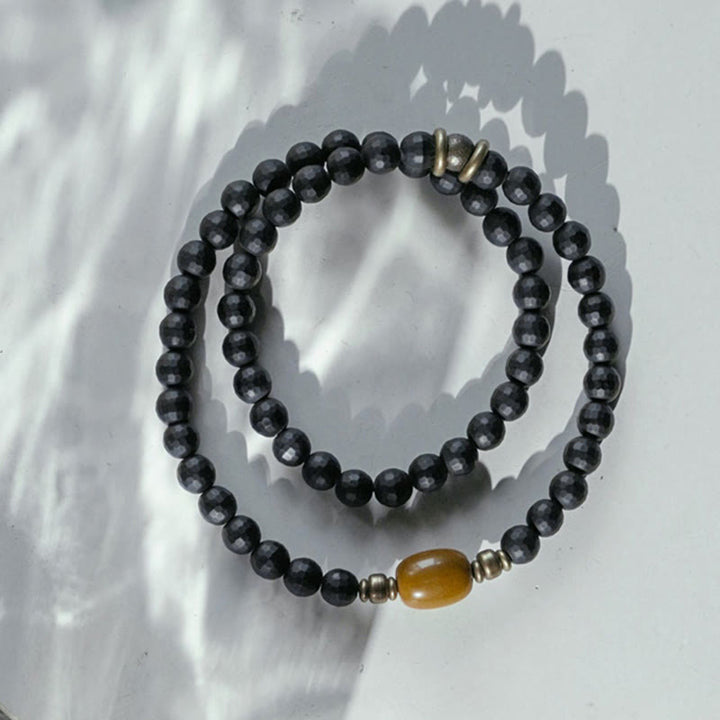 Bracelet de protection à double tour en perles d'onyx noir et de topaze à surface coupée givrée avec Buddha Stones