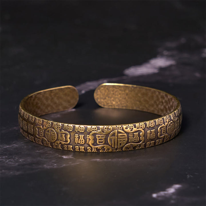 Bracelet porte-bonheur en cuivre et laiton avec personnages de Buddha Stones et cent bénédictions