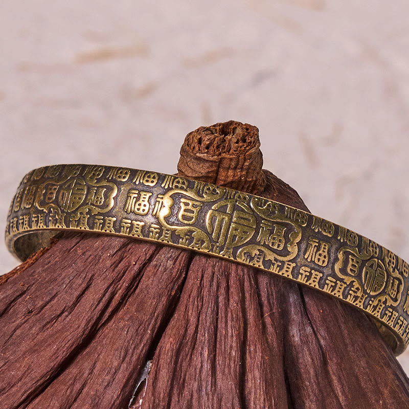Bracelet porte-bonheur en cuivre et laiton avec personnages de Buddha Stones et cent bénédictions