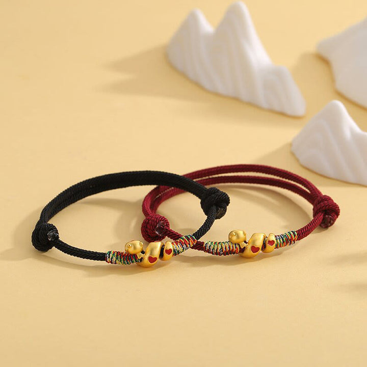 Bracelet tressé en alliage de cuivre avec cordon rouge et Buddha Stones, protection de l'année du serpent