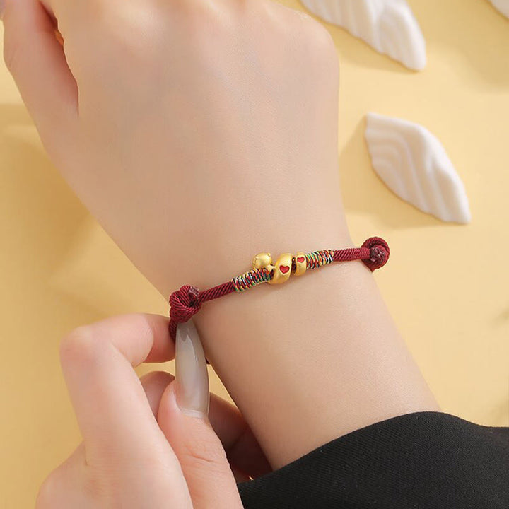 Bracelet tressé en alliage de cuivre avec cordon rouge et Buddha Stones, protection de l'année du serpent