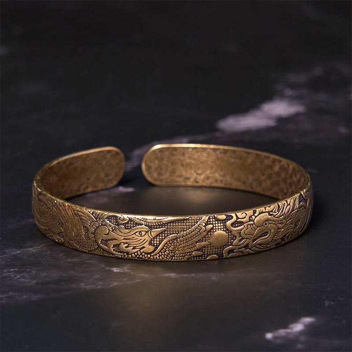 Bracelet de protection porte-bonheur en cuivre et laiton sculpté avec Buddha Stones, dragon et phénix jouant avec une perle
