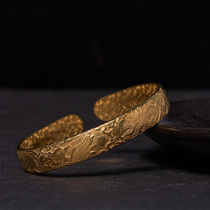 Bracelet de protection porte-bonheur en cuivre et laiton sculpté avec Buddha Stones, dragon et phénix jouant avec une perle