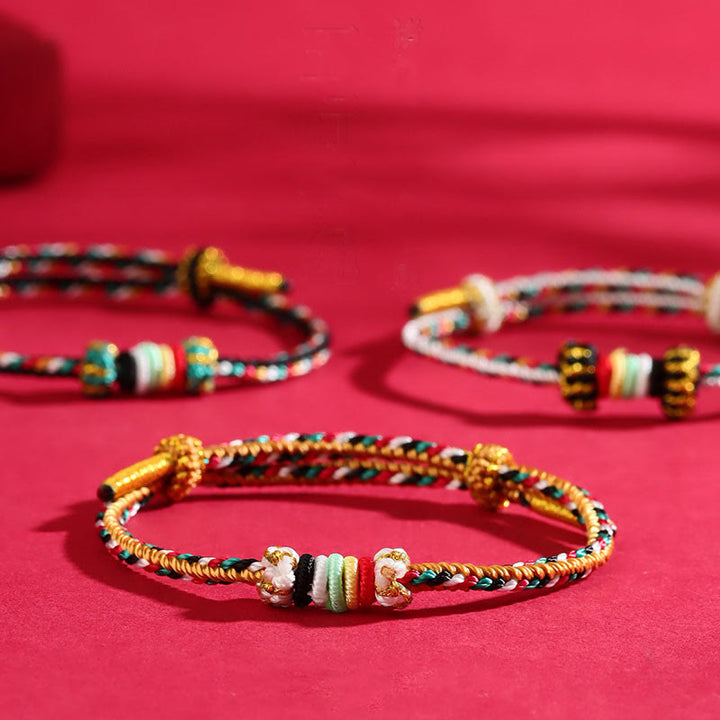 Bracelet porte-bonheur tressé avec nœud de récif et Buddha Stones et cinq éléments colorés