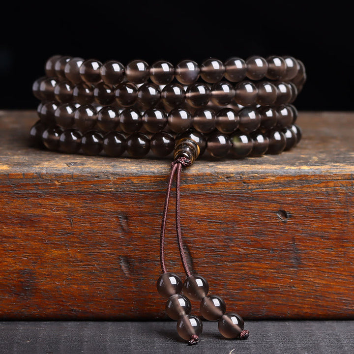 Bracelet Mala 108 perles en obsidienne noire avec Buddha Stones