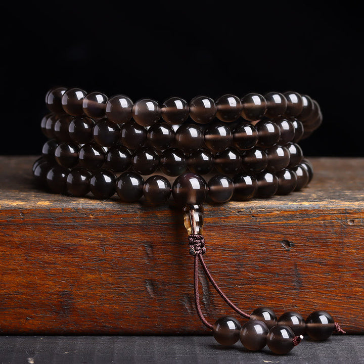 Bracelet Mala 108 perles en obsidienne noire avec Buddha Stones