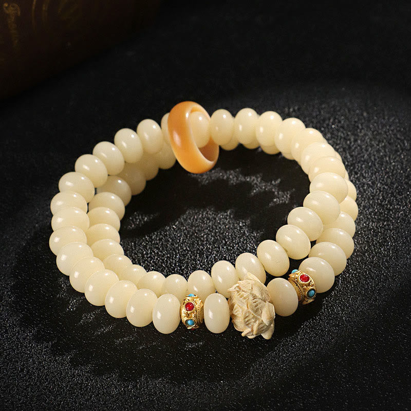 Bracelet double tour en bois de pêche et graines de Bodhi Buddha Stones et lotus