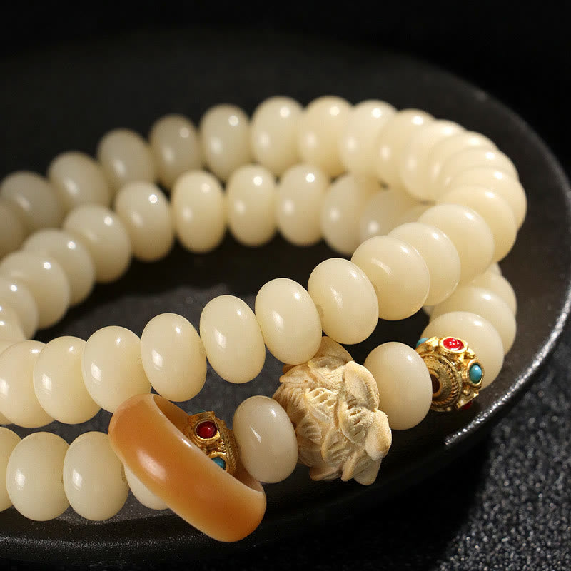 Bracelet double tour en bois de pêche et graines de Bodhi Buddha Stones et lotus