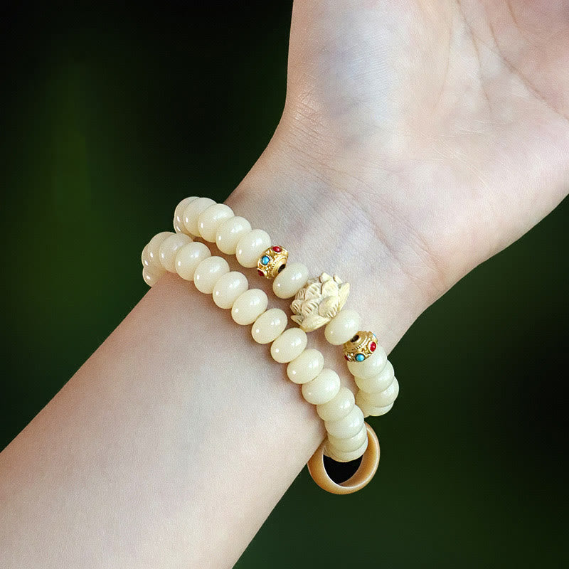 Bracelet double tour en bois de pêche et graines de Bodhi Buddha Stones et lotus