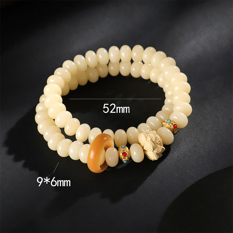 Bracelet double tour en bois de pêche et graines de Bodhi Buddha Stones et lotus