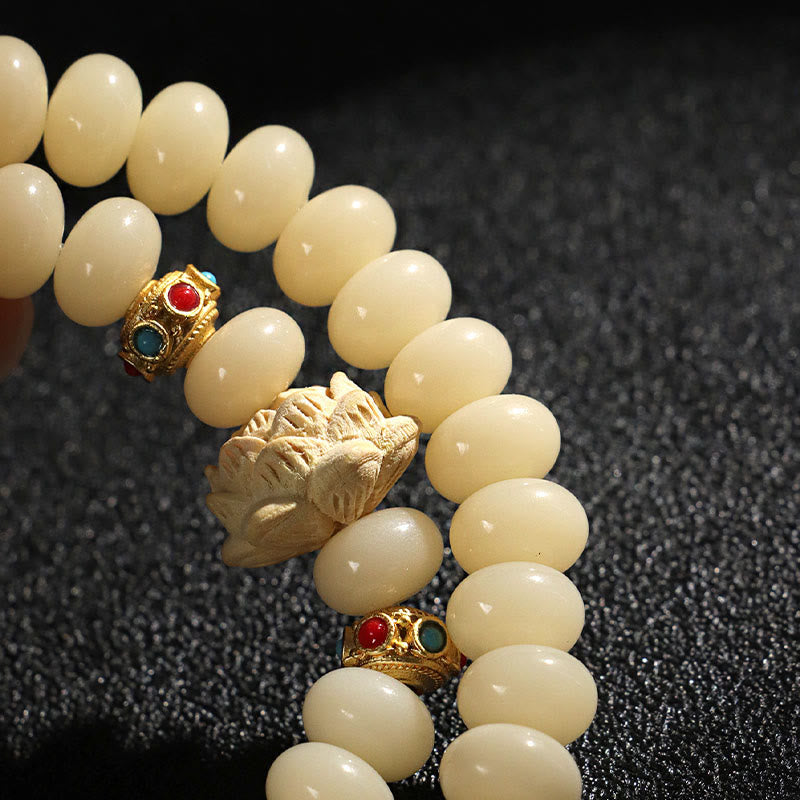 Bracelet double tour en bois de pêche et graines de Bodhi Buddha Stones et lotus