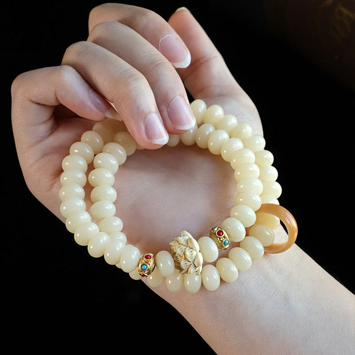 Bracelet double tour en bois de pêche et graines de Bodhi Buddha Stones et lotus