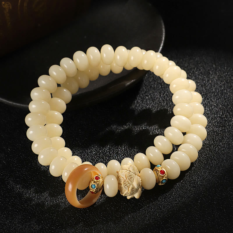 Bracelet double tour en bois de pêche et graines de Bodhi Buddha Stones et lotus