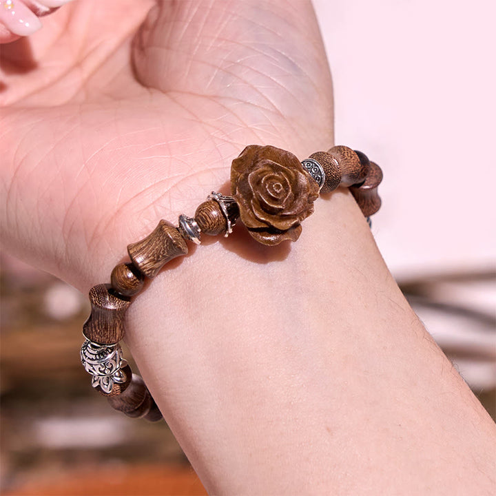 Bracelet de guérison camélia en bois de santal et bambou avec Buddha Stones