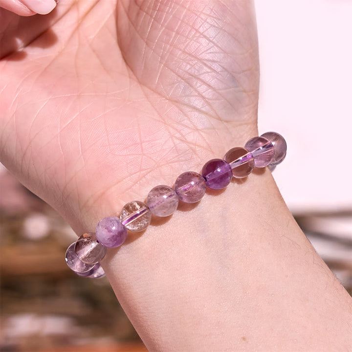 Bracelet de sagesse et d'amour fantôme violet naturel en Buddha Stones
