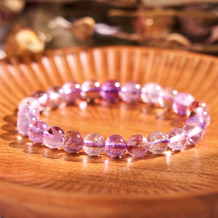 Bracelet de sagesse et d'amour fantôme violet naturel en Buddha Stones