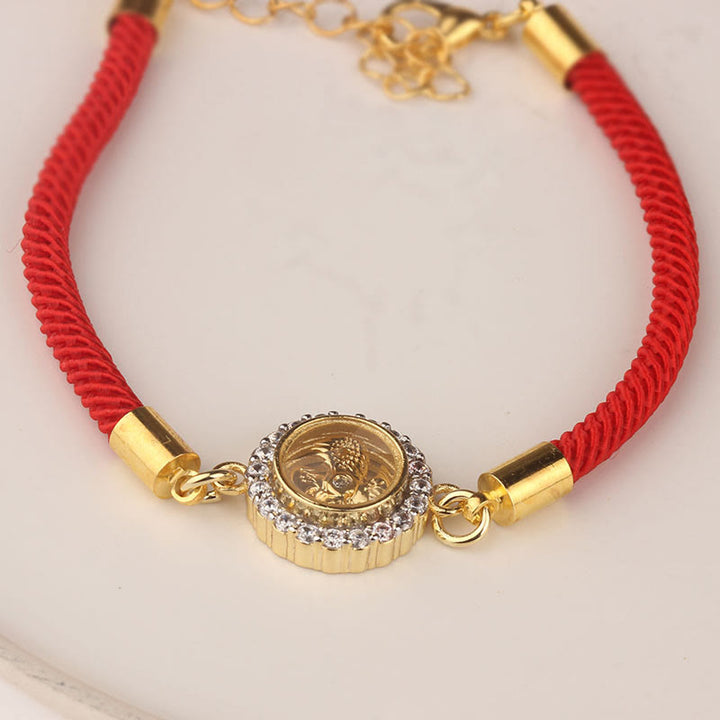 Bracelet tressé de protection Feng Sheng Shui Qi avec moulin à vent rotatif en cuivre et laiton Buddha Stones