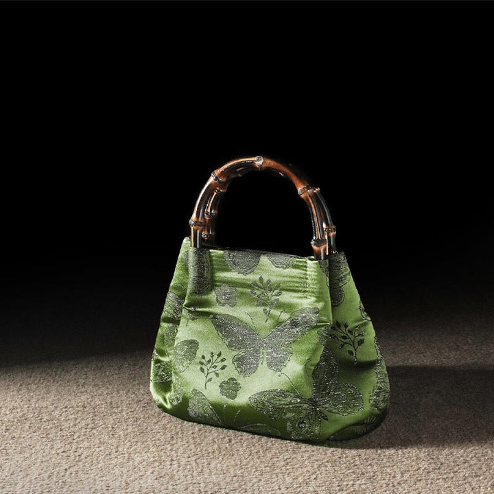 Sac à bandoulière en métal avec poignée en bambou et fleurs en jacquard et papillons Buddha Stones