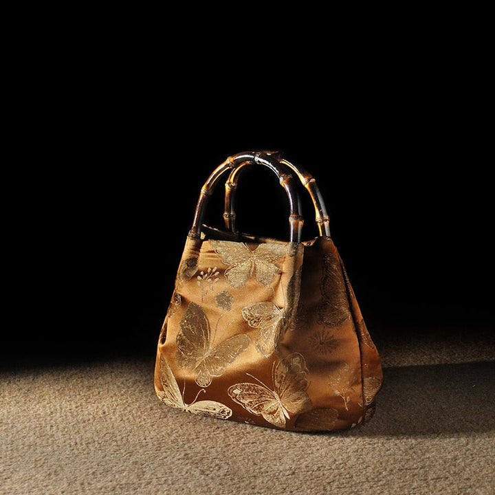 Sac à bandoulière en métal avec poignée en bambou et fleurs en jacquard et papillons Buddha Stones