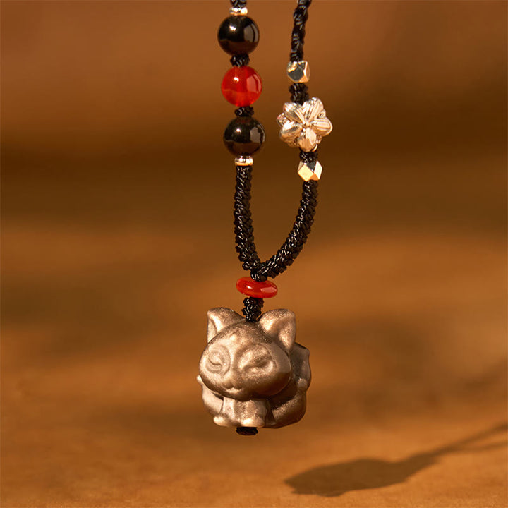 Collier pendentif de protection en obsidienne naturelle argentée et brillante représentant un Buddha Stones à neuf queues