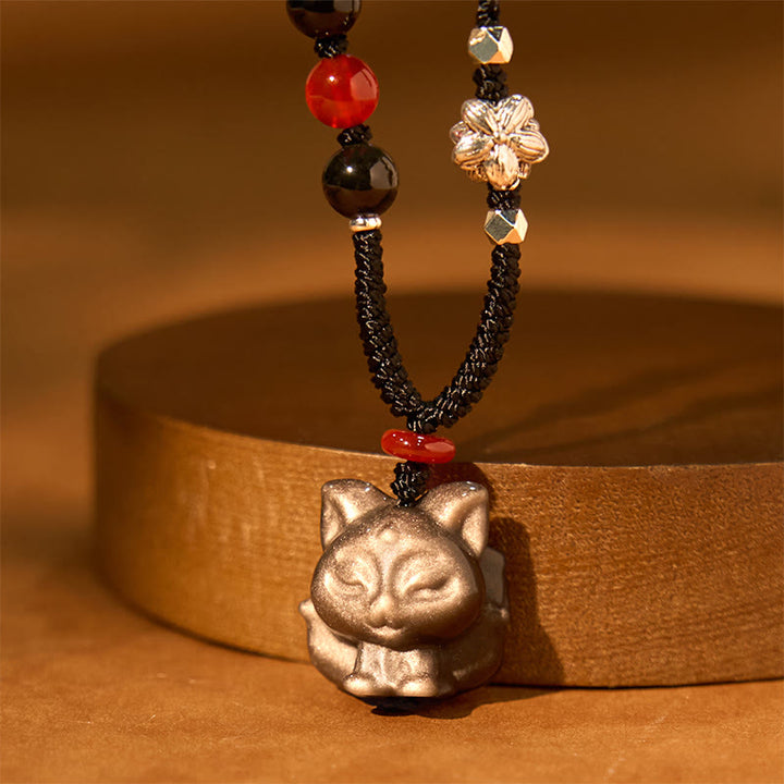 Collier pendentif de protection en obsidienne naturelle argentée et brillante représentant un Buddha Stones à neuf queues