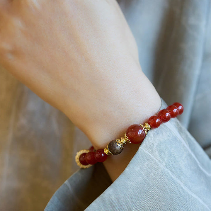 Bracelet de confiance en agate rouge et bois d'agar Buddha Stones