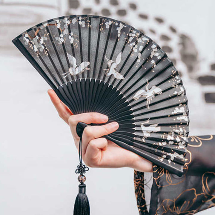 Éventail pliable en bambou à main en soie avec grue en fleurs de prunier et Buddha Stones