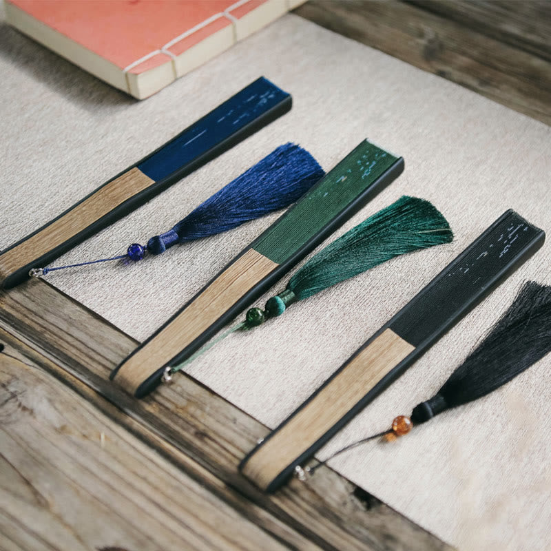 Éventail pliable en bambou à pompons avec Buddha Stones et feuilles de bambou