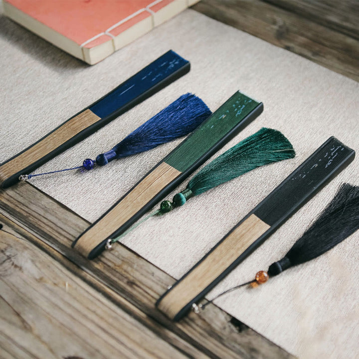 Éventail pliable en bambou à pompons avec Buddha Stones et feuilles de bambou